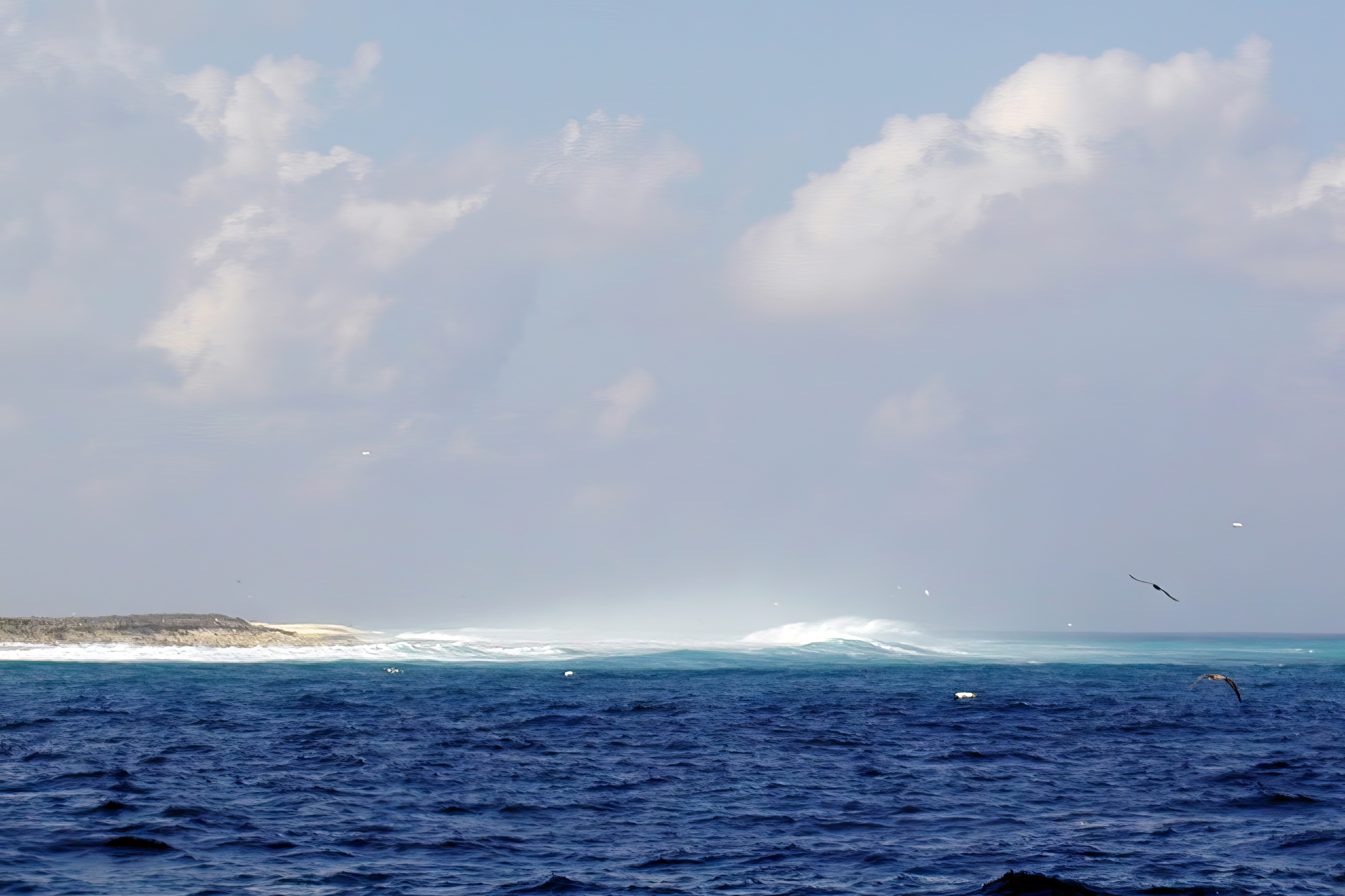 Waves crashing onto the beach on Clipperton Atoll