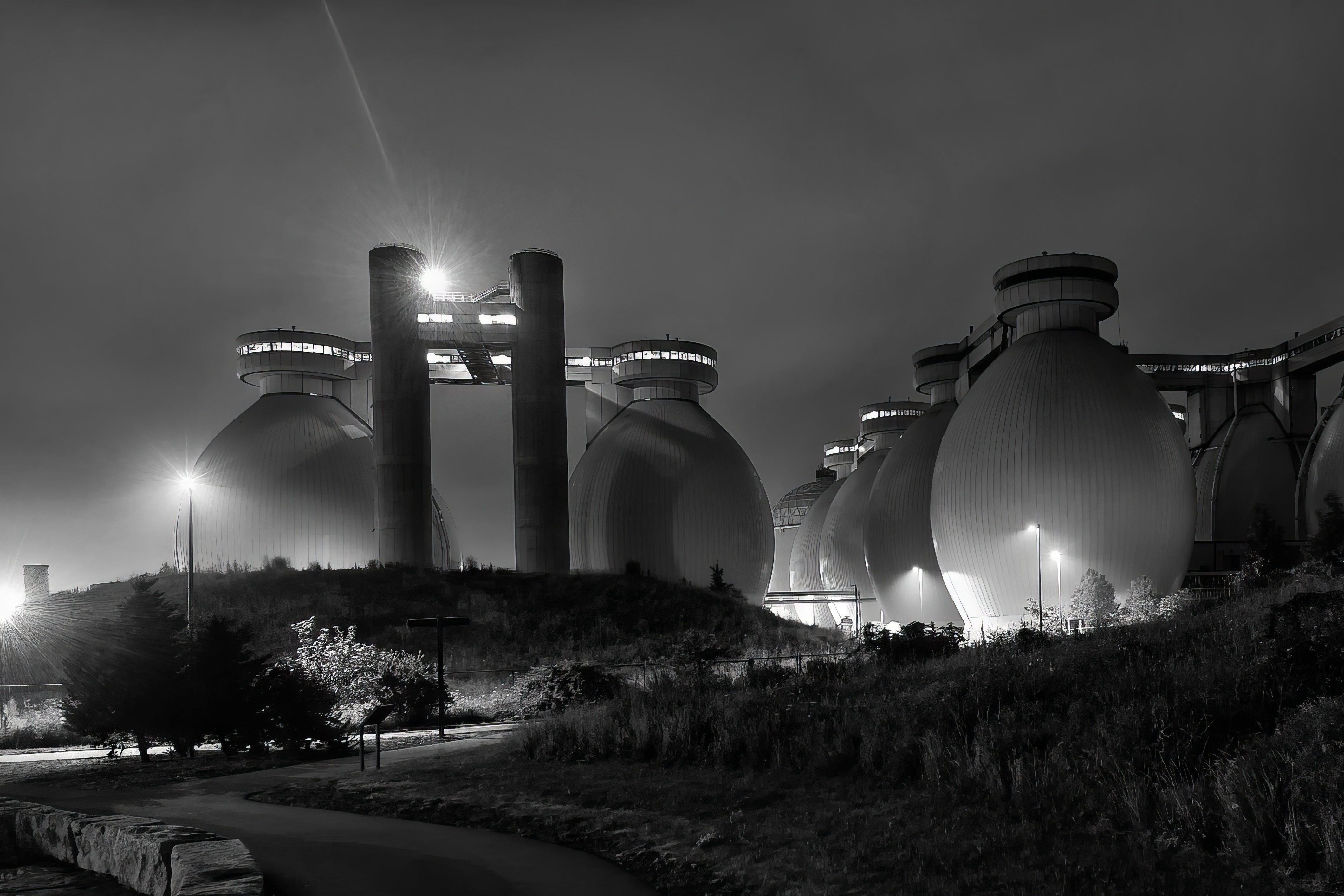 Deer Island wastewater treatment plant tanks at night in 2013