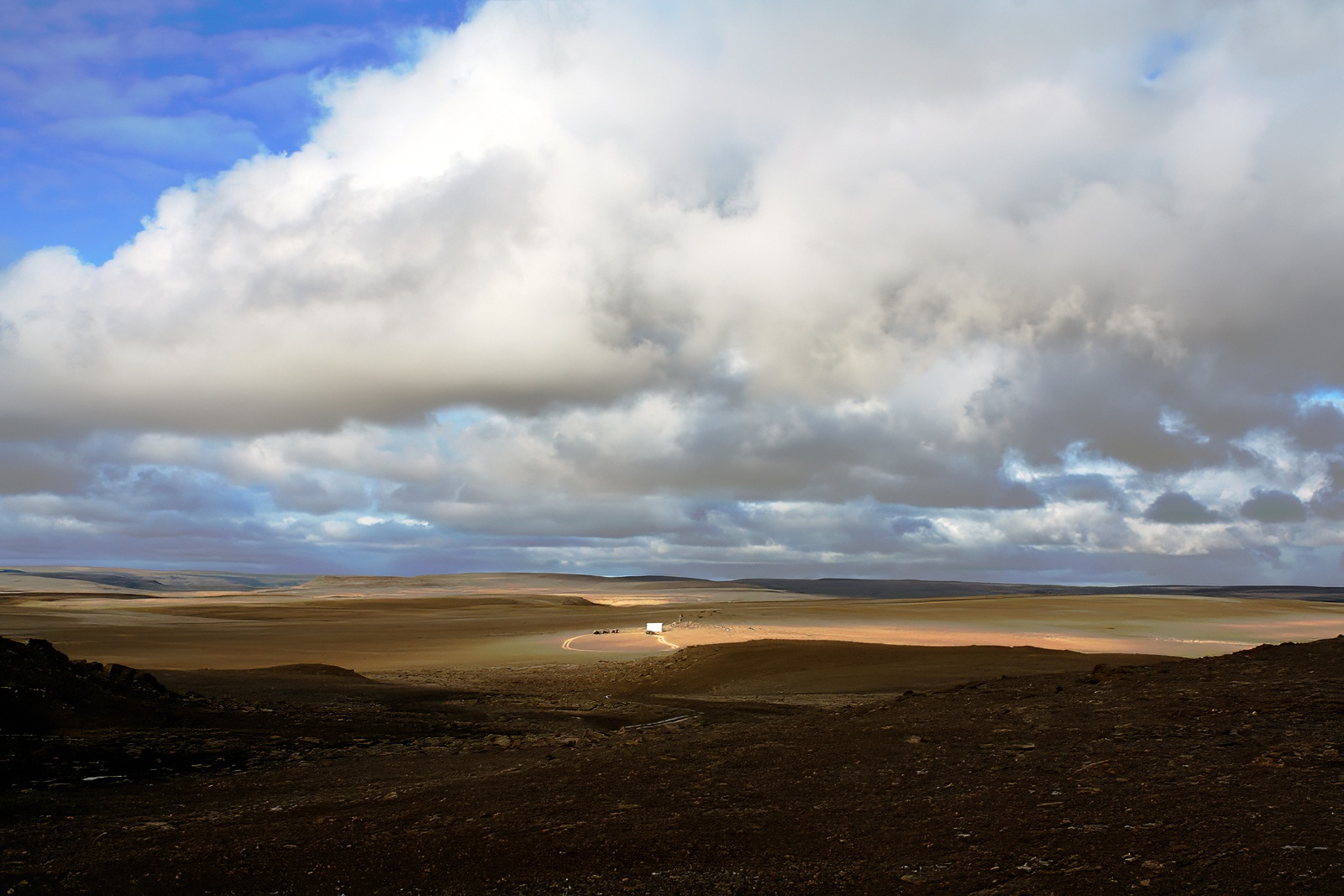 View of Devon Island's barren landscape and a Haughton Mars Project robot tent