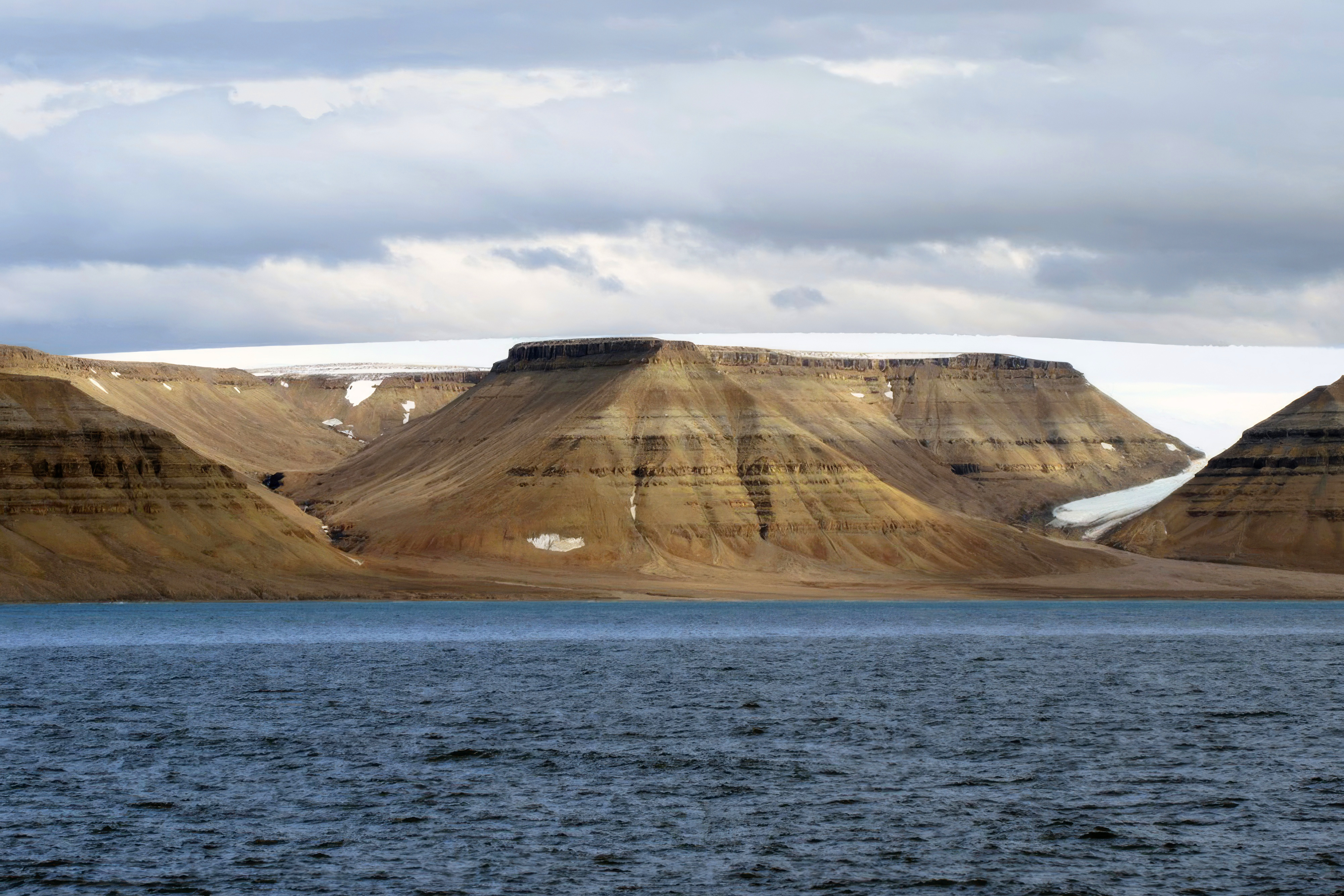 Rugged coastline and glaciers of Cuming Inlet on southern Devon Island